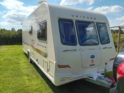 2011 BAILEY UNICORN VALENCIA 4 BERTH FIXED BED TOURING CARAVAN WITH MOTOR MOVER 2011 BAILEY UNICORN VALENCIA 4 BERTH FIXED BED TOURING CARAVAN WITH MOTOR MOVER