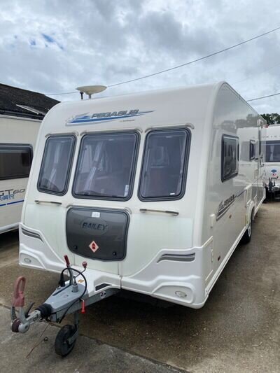 T. Giles. Caravans. At. RH13 ORE. T. Giles. Caravans. At. RH13 ORE.