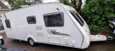 SWIFT CHARISMA 550 2010 4 BERTH FIXED BED CARAVAN WITH MOTOR MOVERS, ACCESSORIES SWIFT CHARISMA 550 2010 4 BERTH FIXED BED CARAVAN WITH MOTOR MOVERS, ACCESSORIES